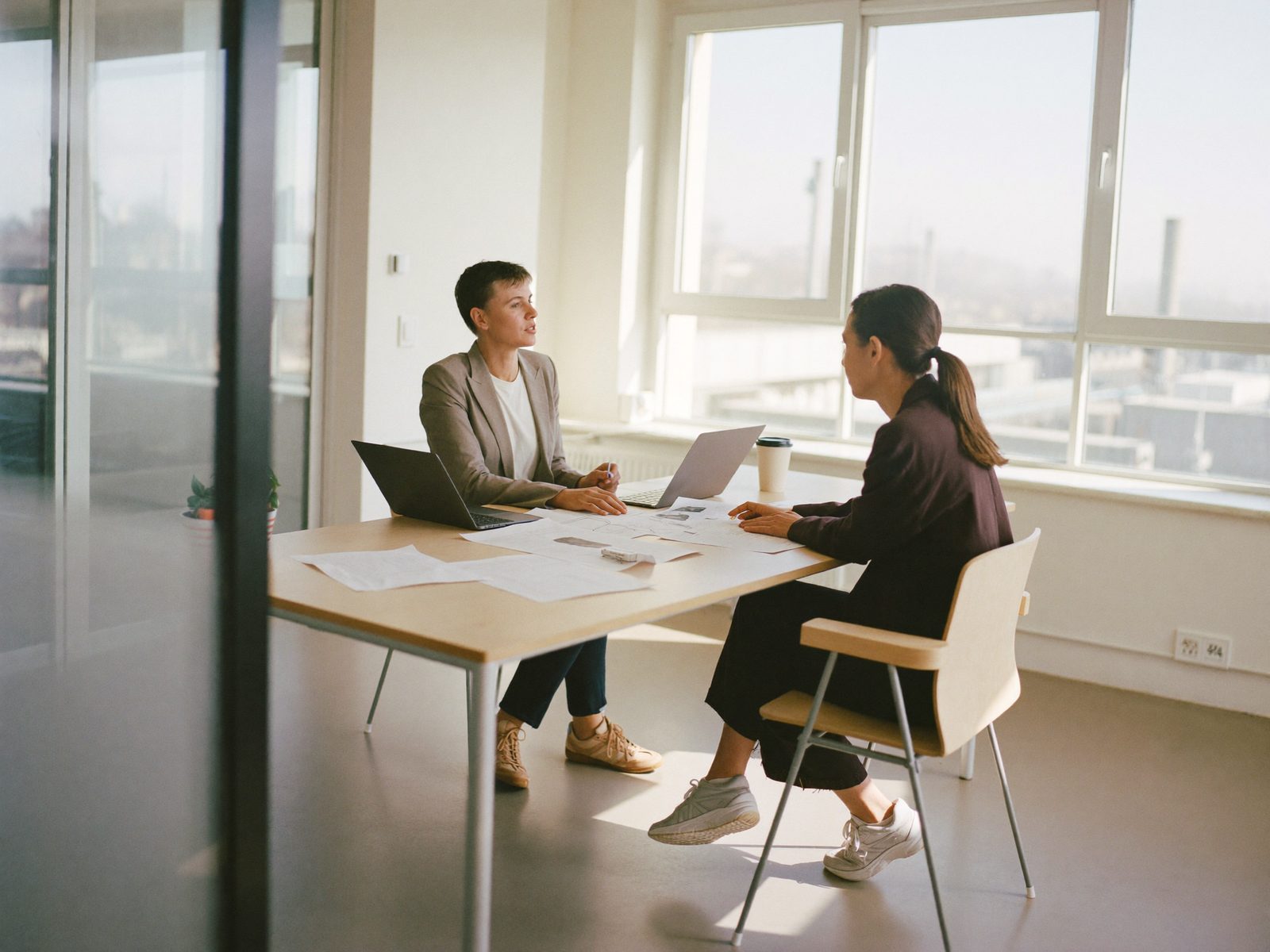 Conversation at a desk in a company office